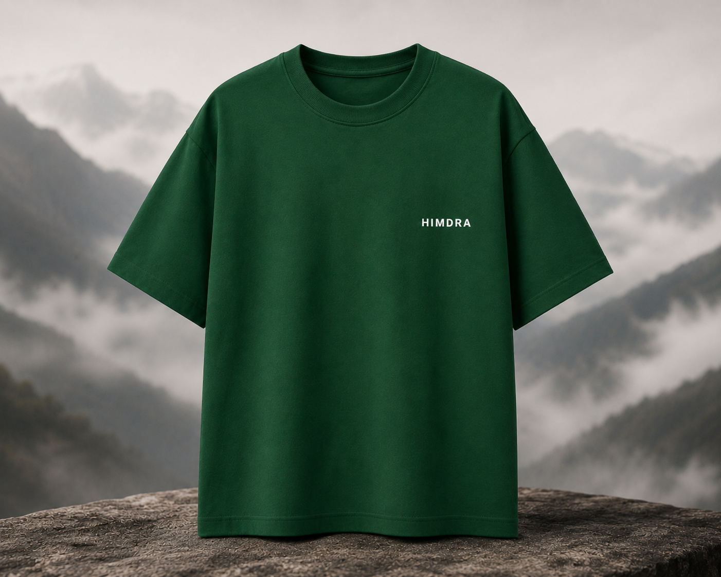 Green t-shirt with 'HIMDRA' logo on a mountain background