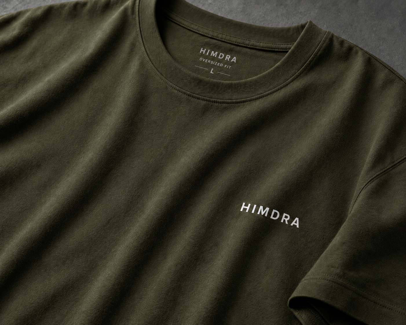 Green t-shirt with 'HIMDRA' branding on a dark background
